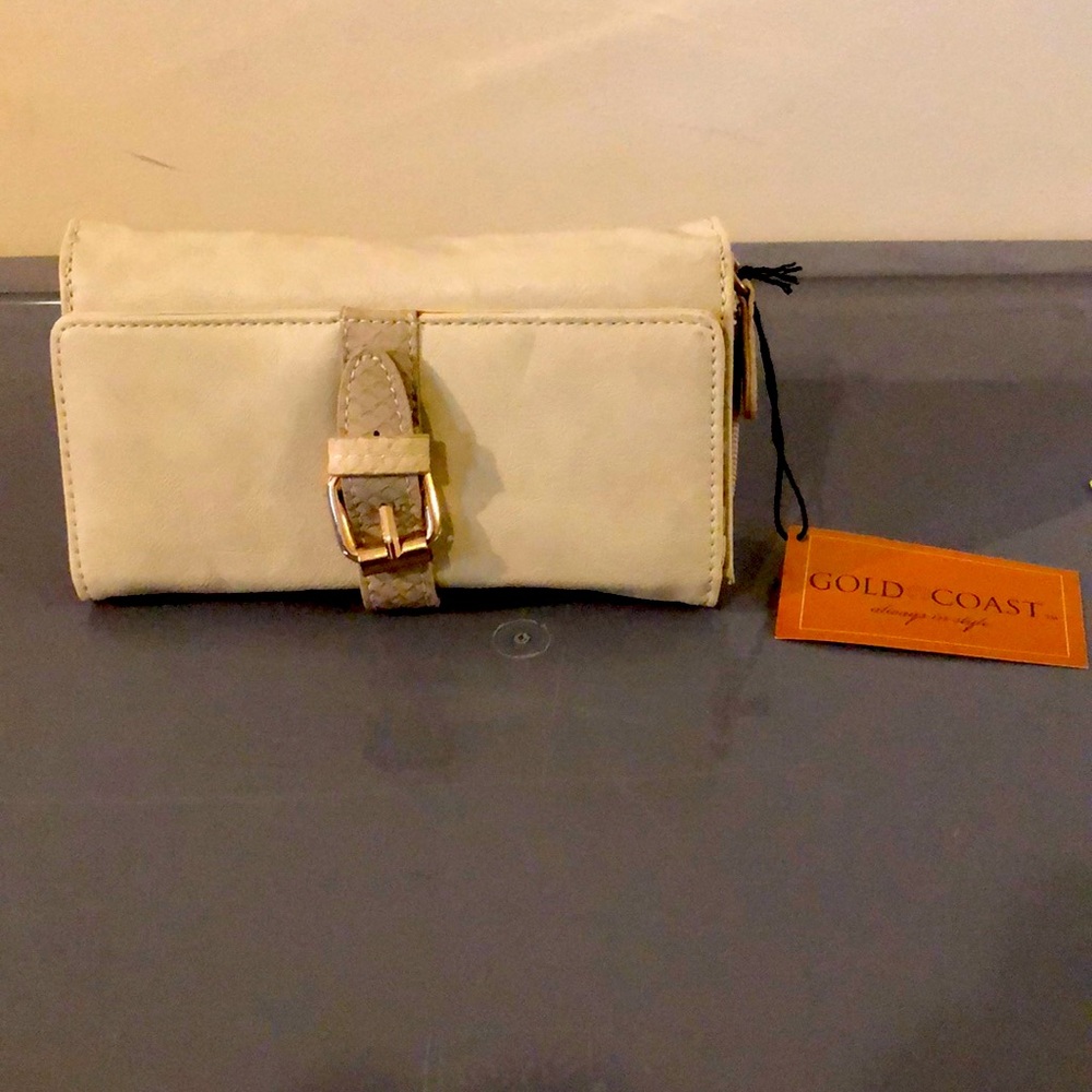 Unused always closeted clutch.